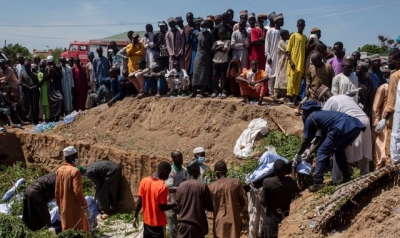 Mass burial after more than 140 killed scavenging fuel from overturned petrol tanker in Nigeria