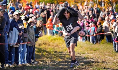 Mud, beer and cash: Annual wife-carrying championship takes Maine by storm