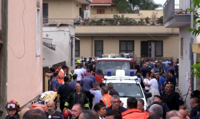 Mother and her two children killed after building collapses