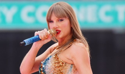 Taylor Swift brings Travis Kelce on stage for the first time - sending fans into a frenzy